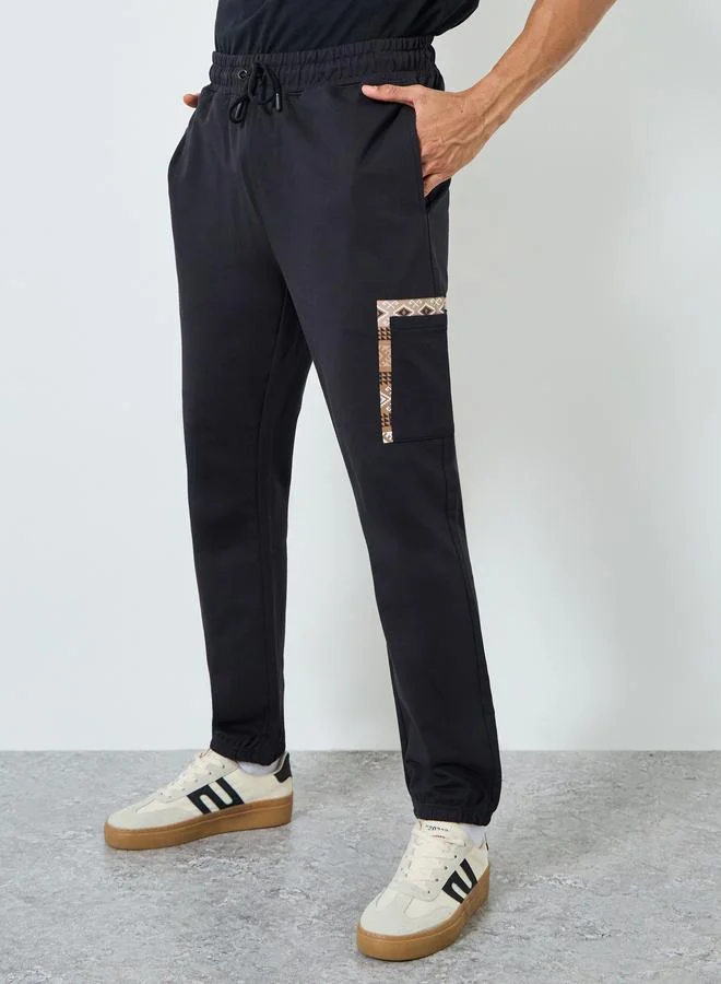 Styli Black Men Black Graphic Print Slim Fit Joggers for Men | Best Price UAE